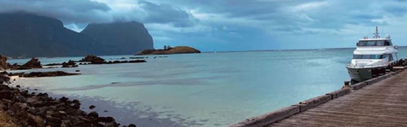 Enigma takes a break amidst the dramatic backdrop of Lord Howe Island in the Tasman Sea. - photo © Horizon Yachts