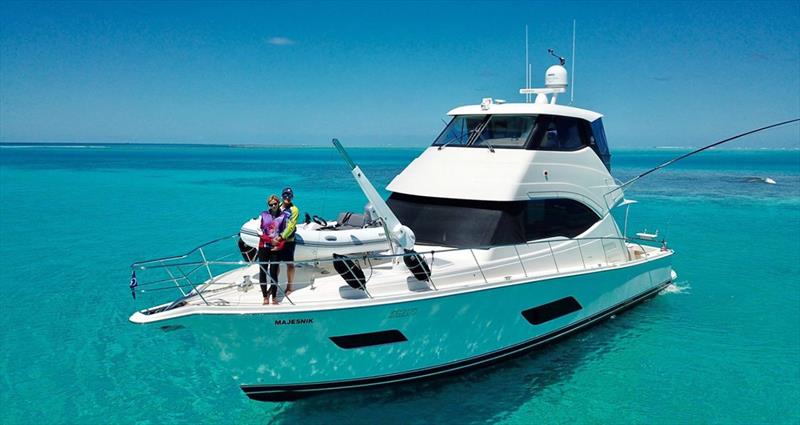 Russell Bianco and Gabriella Gabanna classic blue-water adventure aboard their Riviera 52 Enclosed Flybridge Majesnik photo copyright Denby Browning taken at  and featuring the Power boat class