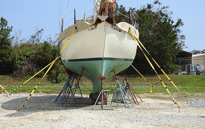 Tie-downs can help prevent a vessel that is stored ashore from being toppled onto its side during high winds. This boat, located at Pensacola Shipyard, Pensacola, Florida, successfully weathered Hurricane Sally as it roared ashore with 105 mph winds photo copyright Scott Croft taken at  and featuring the Power boat class