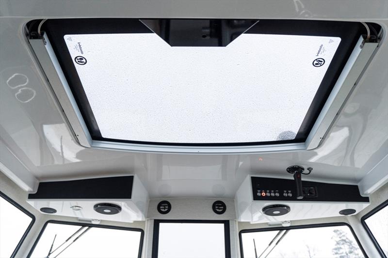 An electric roof hatch is standard equipment. Standard equipment on both versions is comprehensive and includes the 16” Buster Q smart display, Navionics electronic navigation charts, a heater, power steering, sonar, trim tabs, dual battery system & Y-COP - photo © Buster Boats