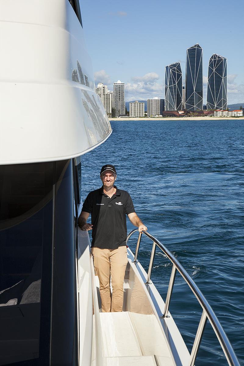 Tom Barry-Cotter under the bridge wings that create space up top for the new Maritimo M55 - photo © John Curnow