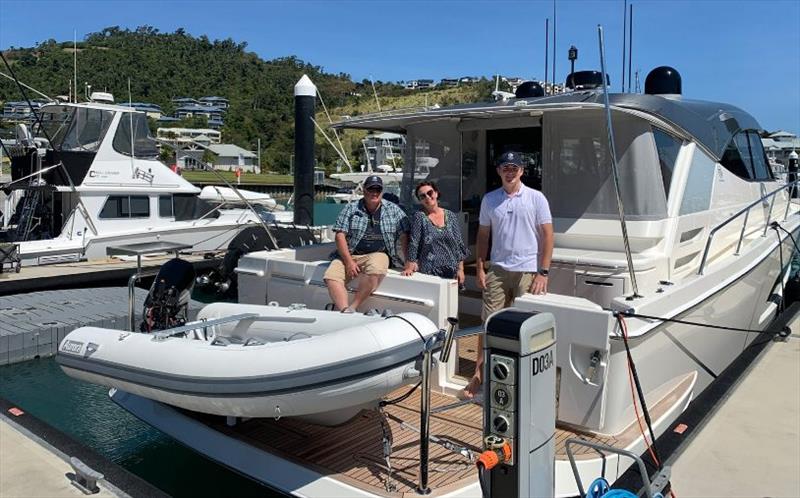 Greg and Aggie Murphy, the proud owners of the new 505 SUV, with Jack Jones from R Marine Jones photo copyright Riviera Australia taken at  and featuring the Power boat class