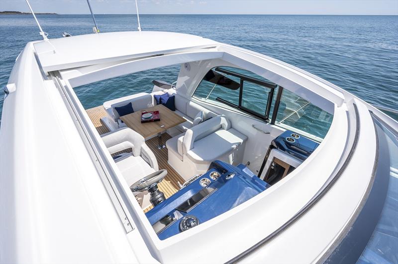 Sliding sunroof, completely open plan spaces, and seats for four facing forward - Beneteau Gran Truismo 36 photo copyright Beneteau taken at  and featuring the Power boat class