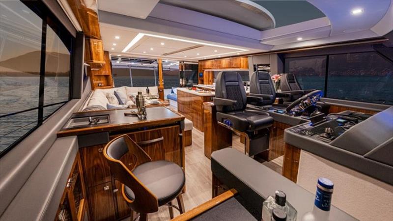 The light-filled entertainer's saloon with a fully equipped aft galley photo copyright Riviera Australia taken at  and featuring the Power boat class
