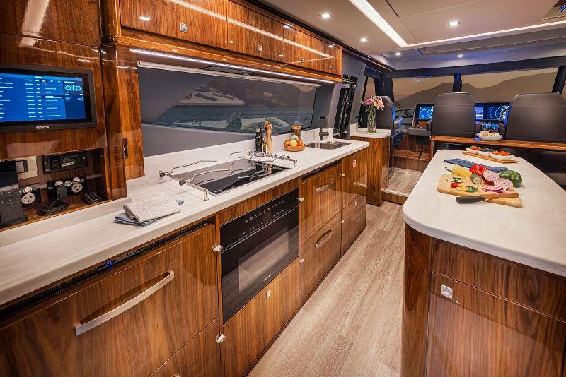Aft galley with island bench, make the most of the grand scale afforded by Riviera's flagship SUV photo copyright Riviera Australia taken at  and featuring the Power boat class