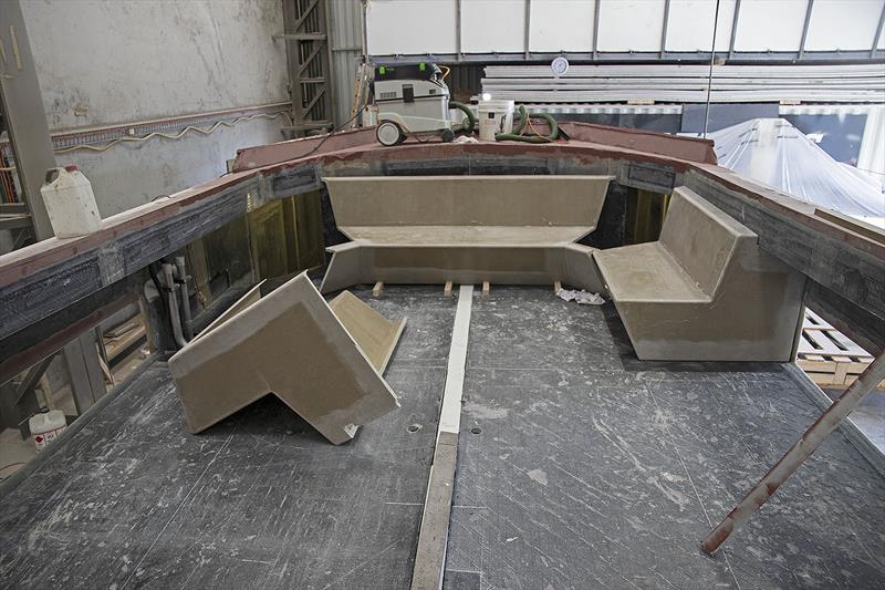 Seating up for'ard under the protective glass, with a cooler in the centre under the table. Three helm chairs across, roughly where the white line is on the deck. BBQ, Fridge and ice maker behind them photo copyright John Curnow taken at  and featuring the Power boat class