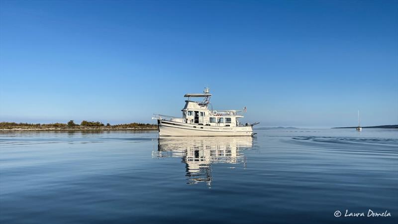 Sandy Island photo copyright Laura Domela taken at  and featuring the Power boat class