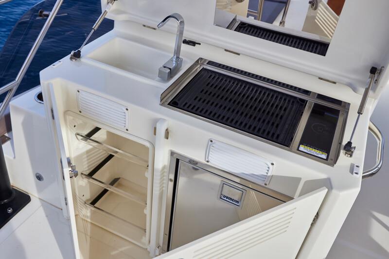 On the bridge deck is the grill, sink, and fridge. Prestige's new M48 powercat - photo © Prestige Yachts