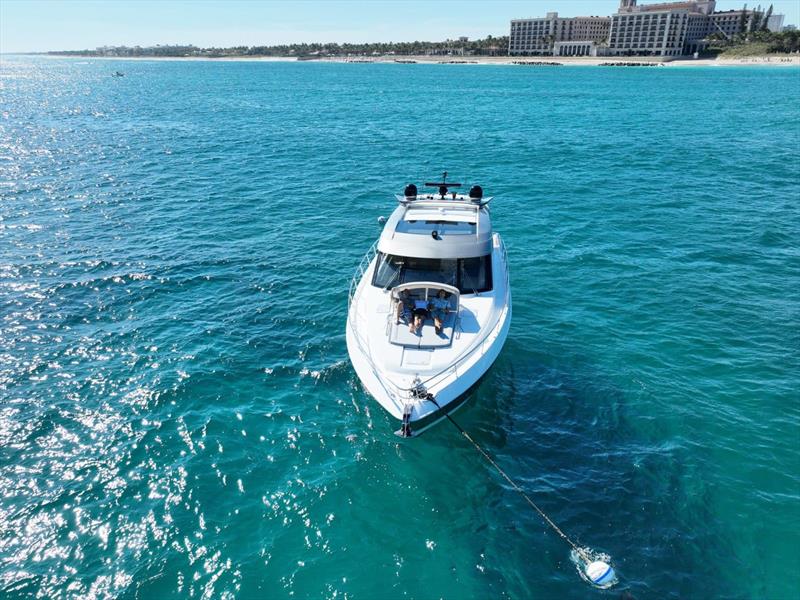 The family relaxing in the sun on Something Bruin - photo © Riviera Australia