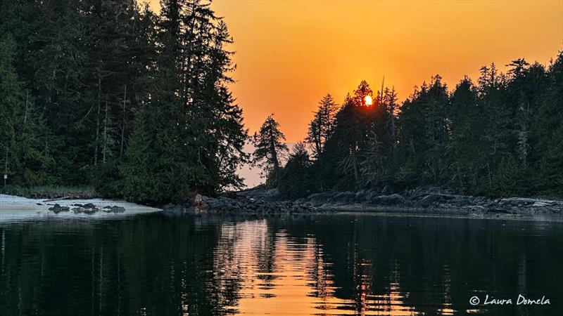 Sunset with smoky sky in Fury Cove photo copyright Laura Domela taken at  and featuring the Power boat class