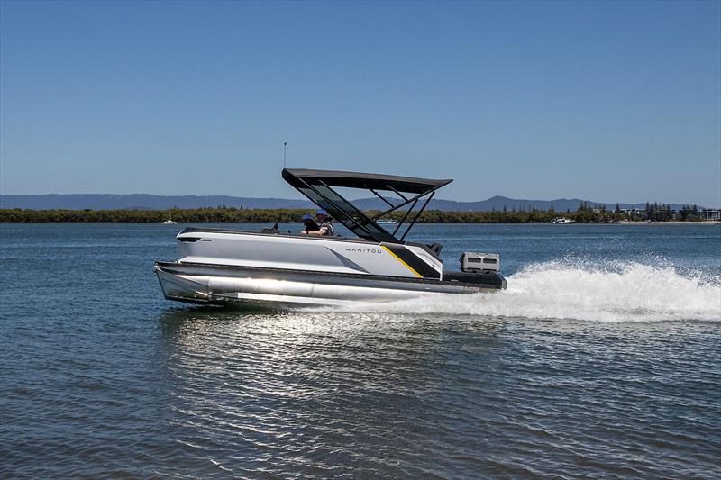 Manitou Explore 22 MAX - shining away in the sun - the planing or lifting strakes on both sides of each pontoon certainly do the job photo copyright John Curnow taken at  and featuring the Power boat class