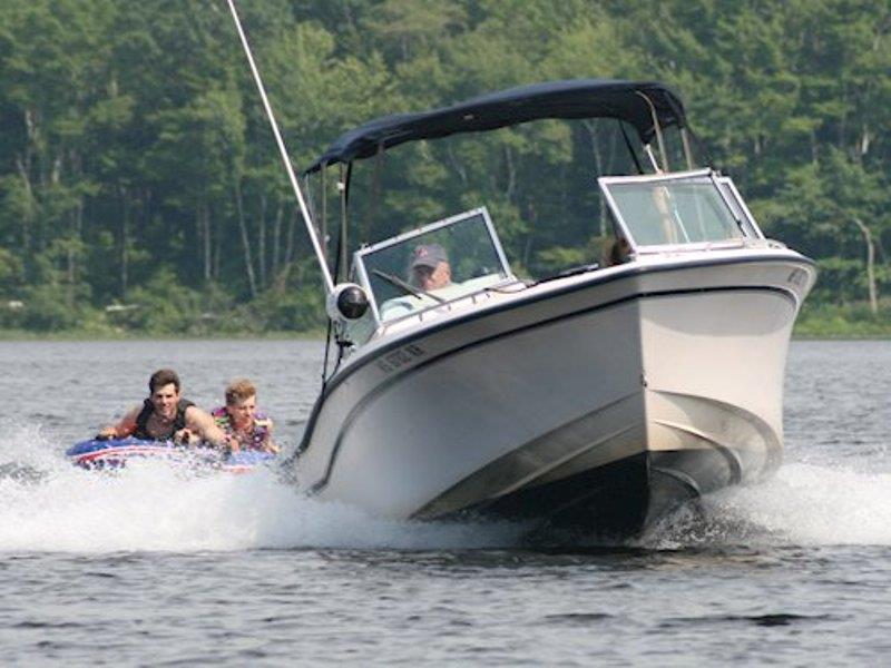 On the Brink has hundreds of hours, maybe thousands, towing water-skiers, wakeboarders, and tubers on Duxbury Bay and lake Damariscotta. Amy Brink, RJ Shea, and Andrew Shea have countless memories being towed behind the dependable boat - photo © Grady-White