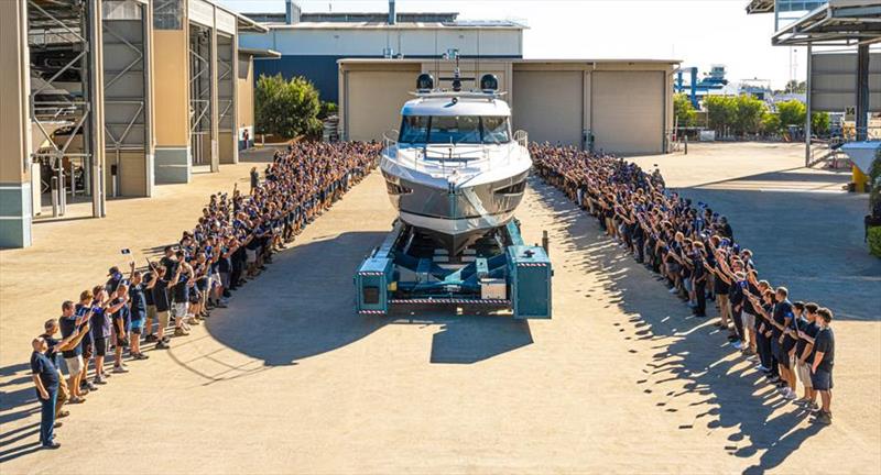 The Riviera team celebrate the launch of their 6,000th motor yacht photo copyright Riviera Australia taken at  and featuring the Power boat class