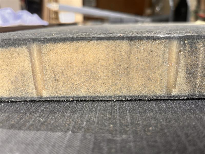 Sprint 20S - Cross section of the cabintop panel. Shows complete resin penetration of the core, and a laminate void of any air entrapment - photo © Valder Yachts