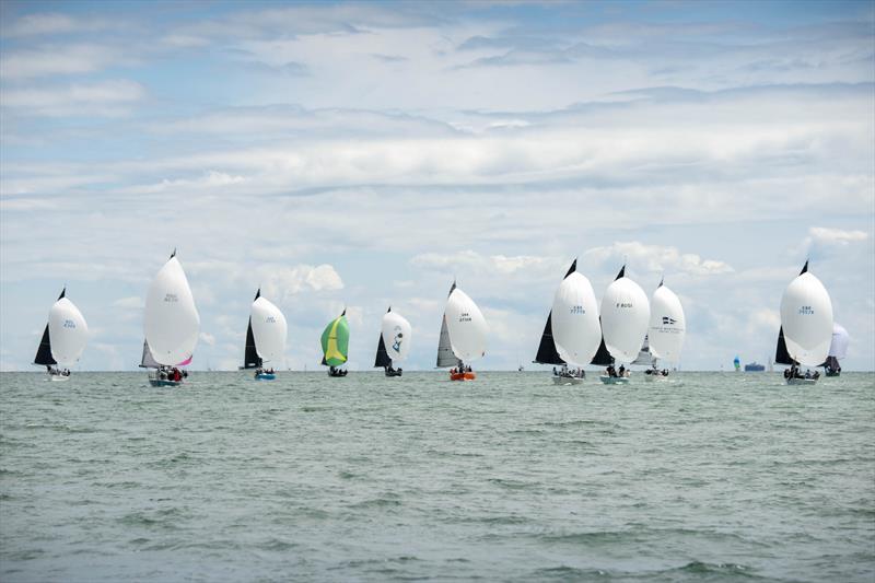 A spectacular sight as the Quarter Ton Cup fleet race downwind on day 2 of the Quarter Ton Cup photo copyright Waterline Media taken at  and featuring the Quarter Tonner class