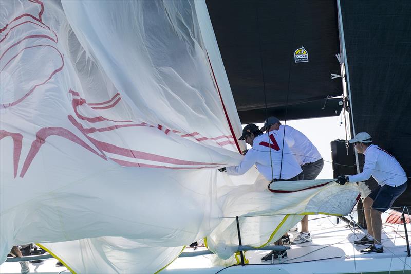 Victoire retrieving their white kite. Airlie Beach Race Week photo copyright Andrea Francolini taken at Whitsunday Sailing Club and featuring the  class