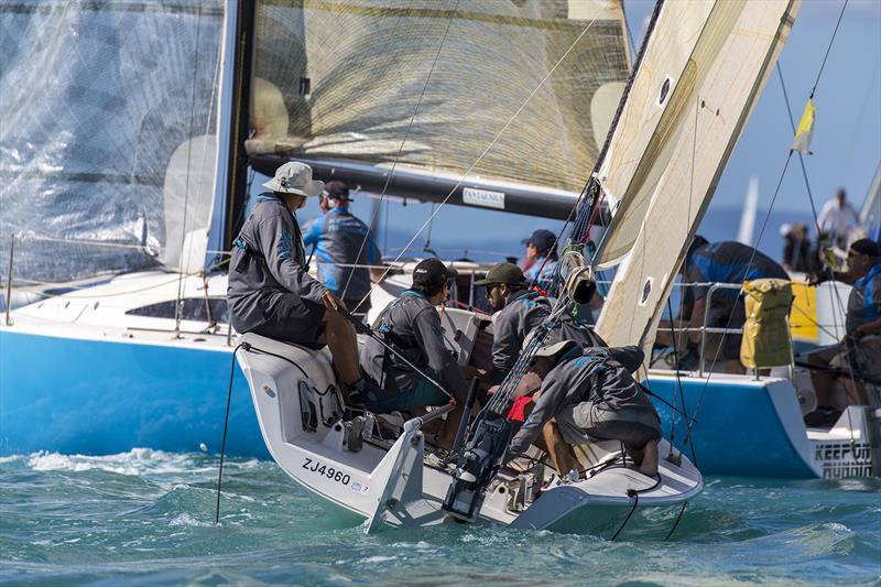 Blue Hull - that counts. Syzygy in the foreground. Airlie Beach Race Week photo copyright Andrea Francolini taken at Whitsunday Sailing Club and featuring the  class