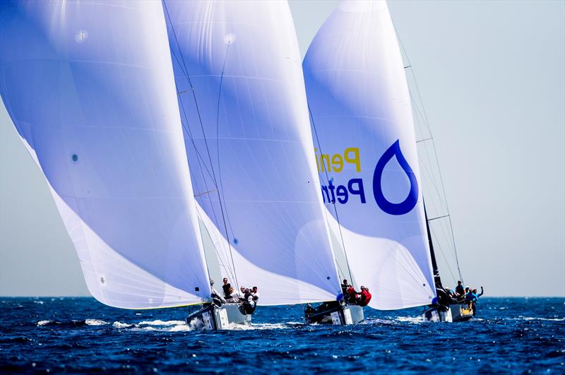 Fleet racing downwind at the RC44 World Championship Marina de Sotogrande - photo © Pedro Martinez / Martinez Studio