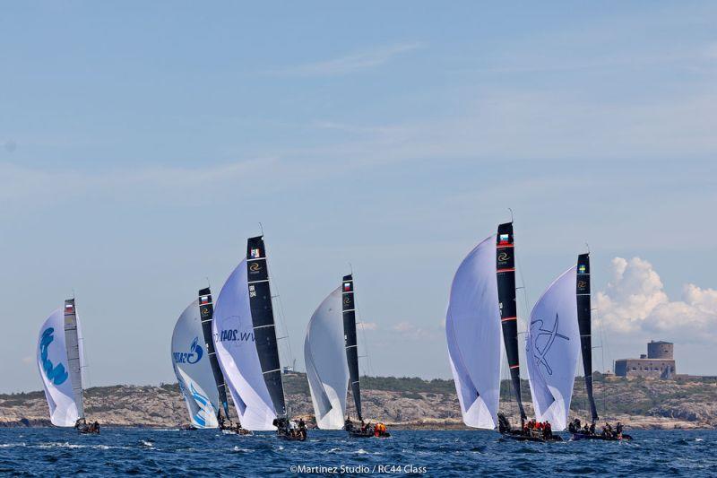 The RC44 fleet runs downwind against the backdrop of the fortress on Marstrand photo copyright Nico Martinez / MartinezStudio taken at  and featuring the RC44 class