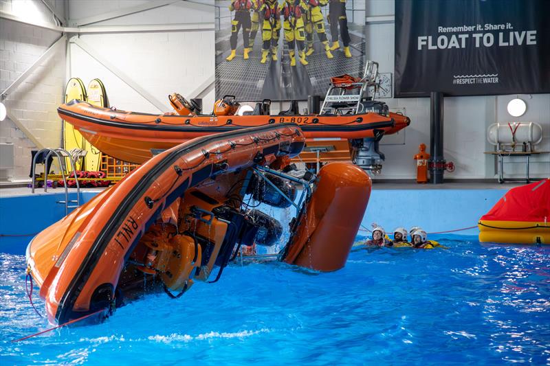 A demonstration of a lifeboat capsize in the sea survival pool at the RNLI College during the festival weekend - photo © RNLI / Nathan Williams