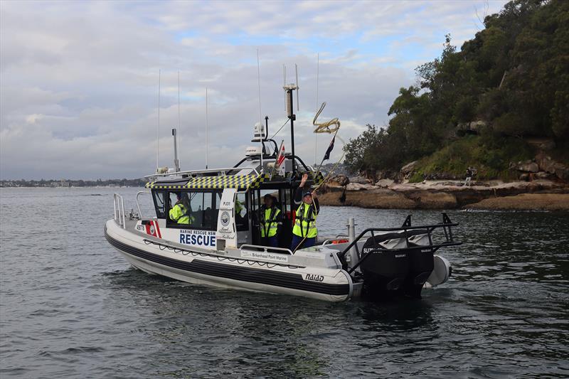 A volunteer crew on board Port Jackson 31 throws a line to a boater in distress photo copyright Marine Rescue NSW taken at  and featuring the RIB class