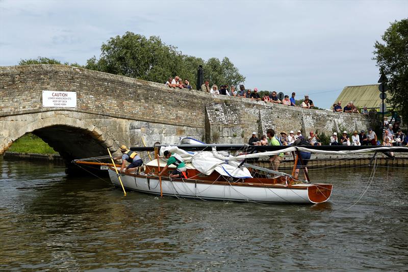 Going under Potter Heigham Bridge during the Three Rivers Race 2019 photo copyright Jane Bowden taken at Horning Sailing Club and featuring the River Cruiser class