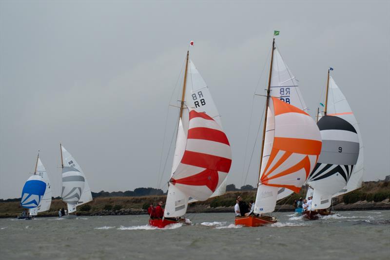Royal Burnham One Design fleet sails during Burnham Week 2025 photo copyright Petru Balau Sports Photography / sports.hub47.com taken at Royal Corinthian Yacht Club and featuring the Royal Burnham One Design class