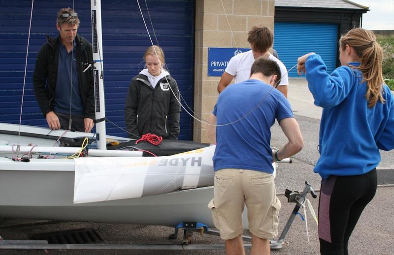 Optimist girls, Emily Mueller and Florence Brellisford, and shore team prepare for sailing on the Endeavour Trophy training day photo copyright Sue Pelling taken at Royal Corinthian Yacht Club, Burnham and featuring the RS200 class