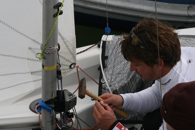Technical repairs aboard the champs' boat during the 2018 Endeavour Trophy photo copyright Sue Pelling taken at Royal Corinthian Yacht Club, Burnham and featuring the RS200 class