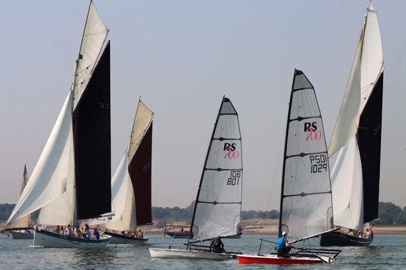 RS700s and barges on day 3 of the Noble Marine RS700 Nationals at Brighlingsea photo copyright William Stacey taken at Brightlingsea Sailing Club and featuring the RS700 class