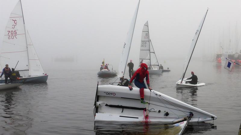 Spider-woman climbing back into her boat during the Hunt Cup 2021 at Lymington Town Sailing Club photo copyright Richard Russell, Sue Markham & Abbey Knightly-Hanson taken at Lymington Town Sailing Club and featuring the RS Aero class