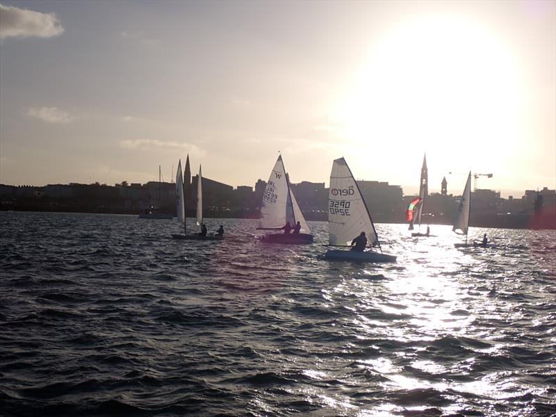 Monica Schaeffer's Wayfarer 11299 and Charlotte O'Kelly's Aero 7 3290 going upwind with the GP14 of Mulvey & Murphy going the opposite way as Dun Laoghaire Frostbite Series 2 gets underway photo copyright Cormac Bradley taken at Dun Laoghaire Motor Yacht Club and featuring the  class