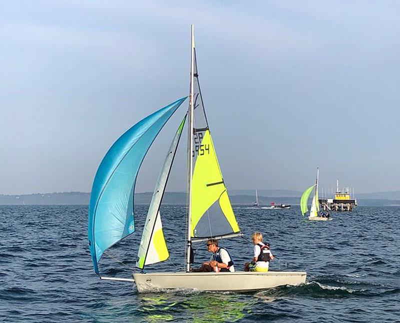 Mark Jardine crewing for his son Sean in the RS Feva photo copyright Rupert Baddeley taken at Royal Lymington Yacht Club and featuring the RS Feva class