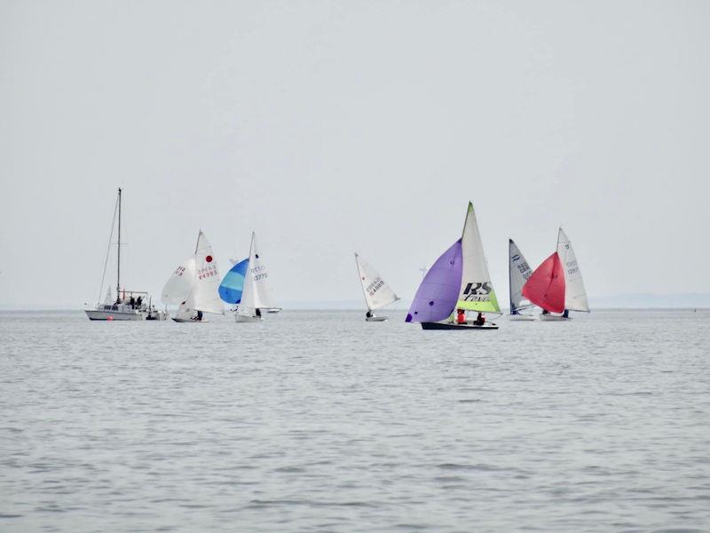 ”Alicat” the Committee boat (left) prepares the Regatta starting area, shortly before the gun for the Kippford RNLI Regatta Race photo copyright Tom Iglehart taken at Solway Yacht Club and featuring the RS Feva class
