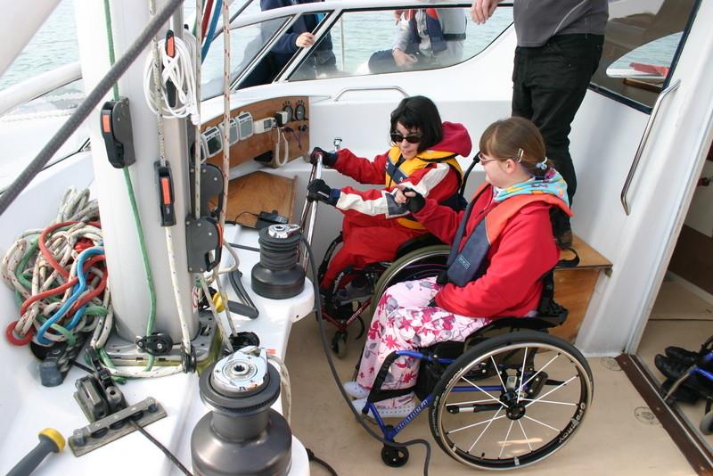 Disabled sailors at the helm of the 'Scott Bader' photo copyright Disabled Sailors Association taken at  and featuring the RYA Sailability class