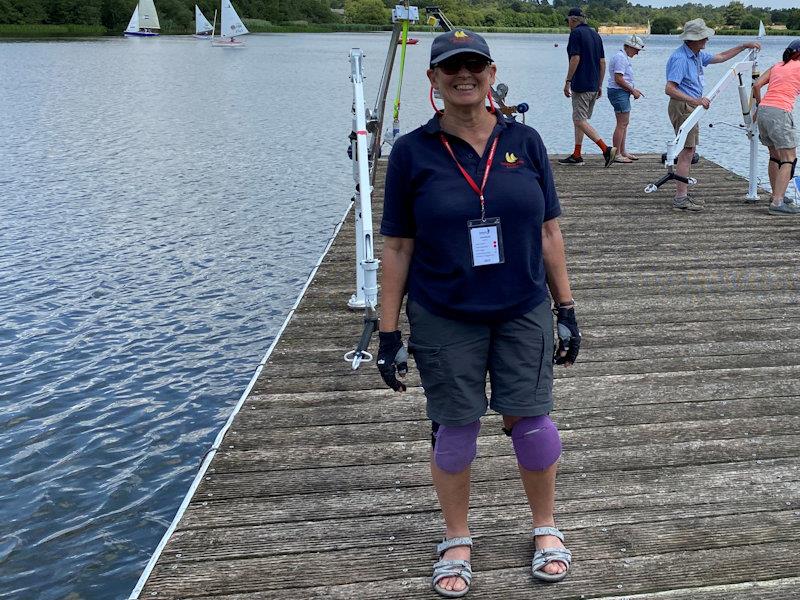 Volunteers working at Sailability clubs soon realise the importance of knee pads, as they spend so long kneeling on the jetty, leaning over dinghies moored alongside! photo copyright Magnus Smith taken at Frensham Pond Sailability and featuring the RYA Sailability class