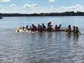 Sabot kids having lots of fun on the floating foam lily pad while waiting for the breeze to come in during the 58th Sabot National Championship © Rohan Nosworthy