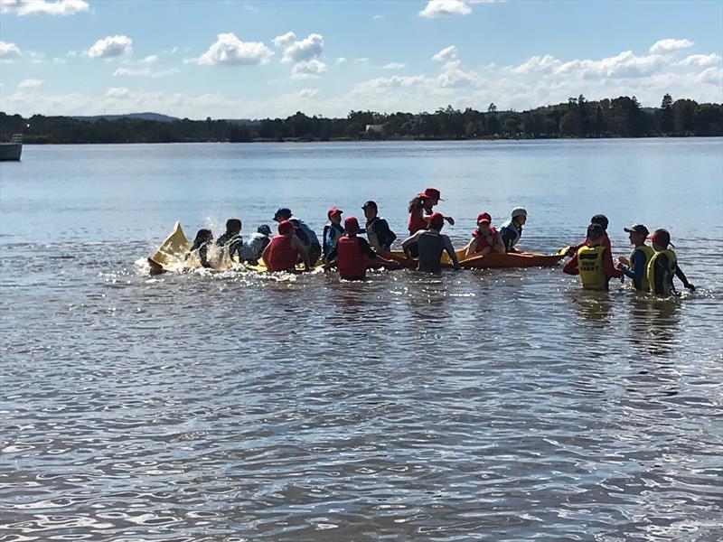 Sabot kids having lots of fun on the floating foam lily pad while waiting for the breeze to come in during the 58th Sabot National Championship photo copyright Rohan Nosworthy taken at Teralba Amateur Sailing Club and featuring the Sabot class