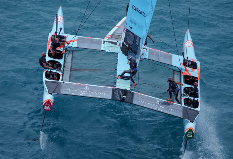 Great Britain SailGP team running across the F50 as they make a manoeuvre in Race Day 1 of Bermuda SailGP  Season 3, in Bermuda. May 2022 - photo © Bob Martin/SailGP