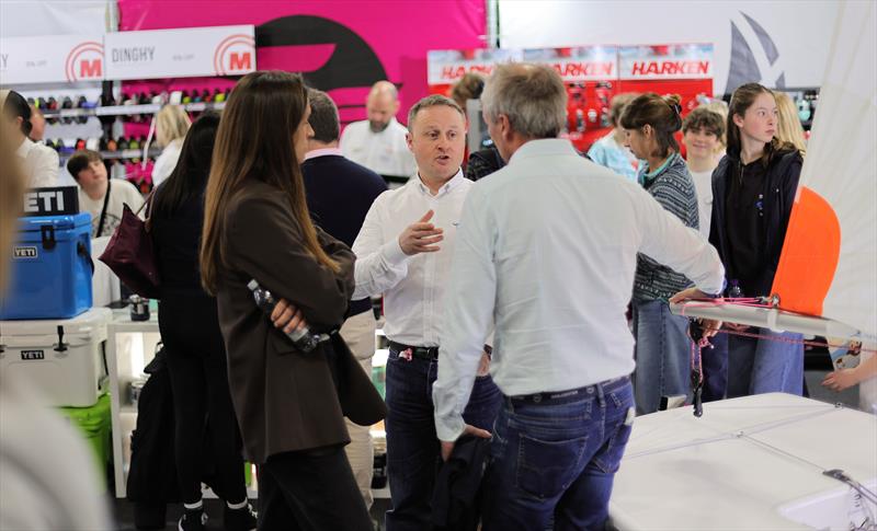Duncan chatting with customers on the buzzing Sailingfast stand at the RYA Dinghy & Watersports Show 2026 - photo © Mark Jardine