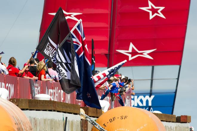 Emirates Team New Zealand supporters waving flags from the dock on day three of the America’s Cup 34.  San Francisco. 10/9/2013 © Chris Cameron/ETNZ http://www.chriscameron.co.nz