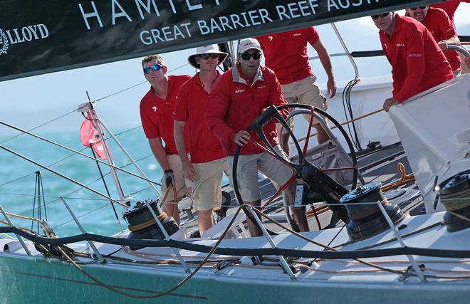 Mark Richards steering Wild Oats XI past the media boat to the start line © Crosbie Lorimer http://www.crosbielorimer.com