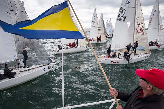 Howth Yacht Club, Co. Dublin, Ireland; Thursday 29th August 2013: The General Recall flag is displayed by Alan Pearson after the start of a race during the penultimate day at the BMW J24 World Championships at Howth Yacht Club where 40 boats from ten nations are competing. © David Branigan/Oceansport http://www.oceansport.ie/