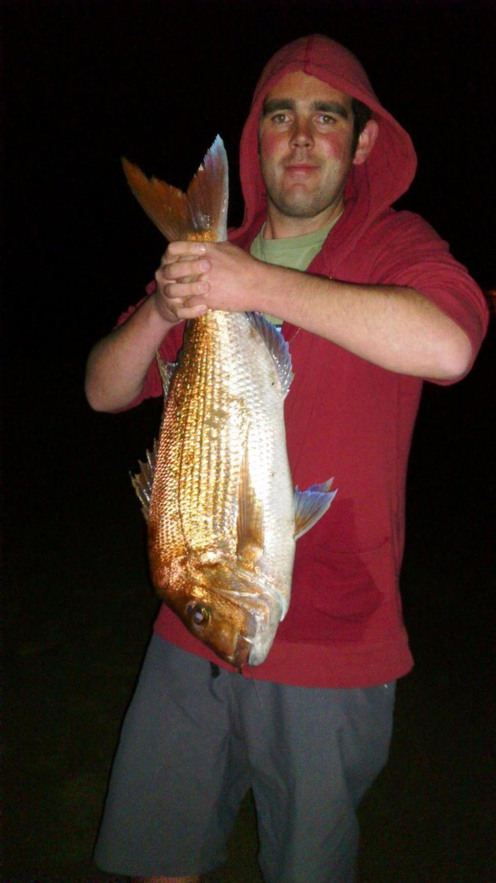 Troy Parker with a snapper taken from Bellerive Beach © Carl Hyland
