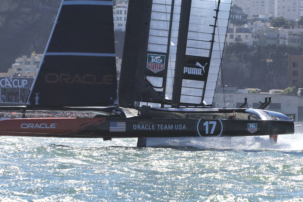 Looking like a crewless ghost ship, Oracle crosses the line at the race two finish, now four races behind ETNZ - America's Cup photo copyright Chuck Lantz http://www.ChuckLantz.com taken at  and featuring the  class