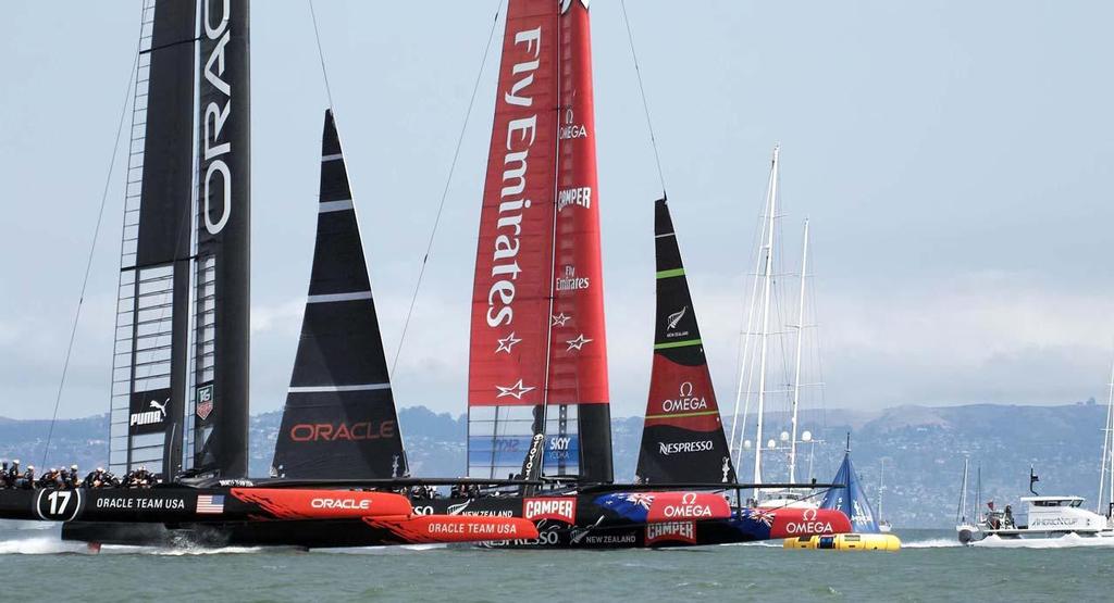 Emirates Team NZ and Oracle Team USA at the start of race 5 on day 3 of the 34th America’s Cup photo copyright Chuck Lantz http://www.ChuckLantz.com taken at  and featuring the  class