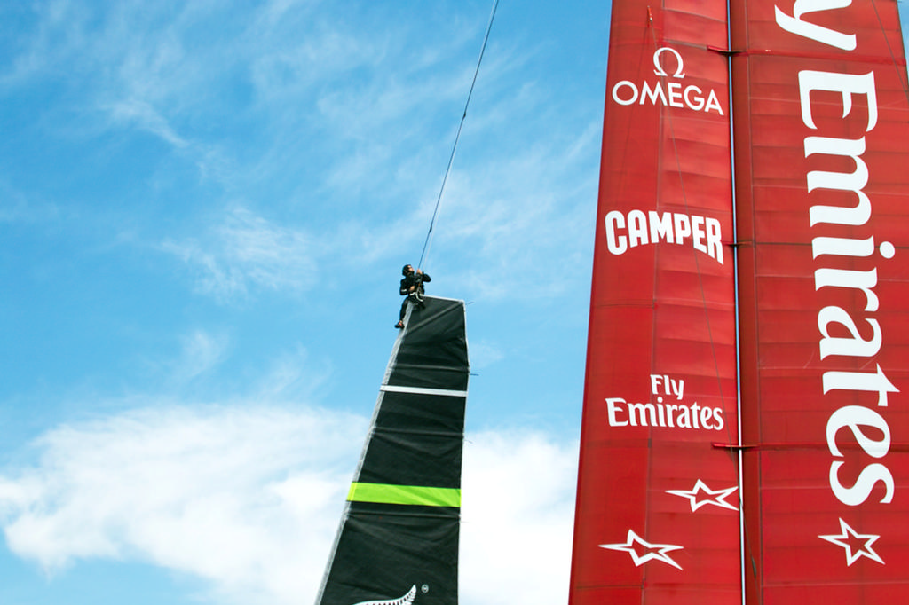 As the New Zealand boat moves to the starting area, the jib is hoisted and secured.  - America’s Cup © Chuck Lantz http://www.ChuckLantz.com