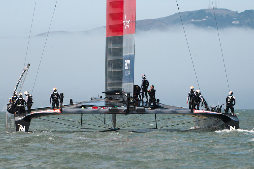 Black-helmeted support crew prepare to leave the race boat. - America’s Cup © Chuck Lantz http://www.ChuckLantz.com