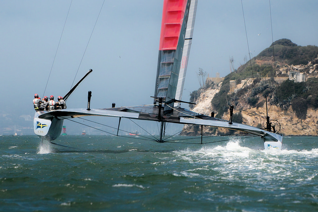 Luna Rossa moves past Alcatraz towards the start of race 2. - America’s Cup © Chuck Lantz http://www.ChuckLantz.com