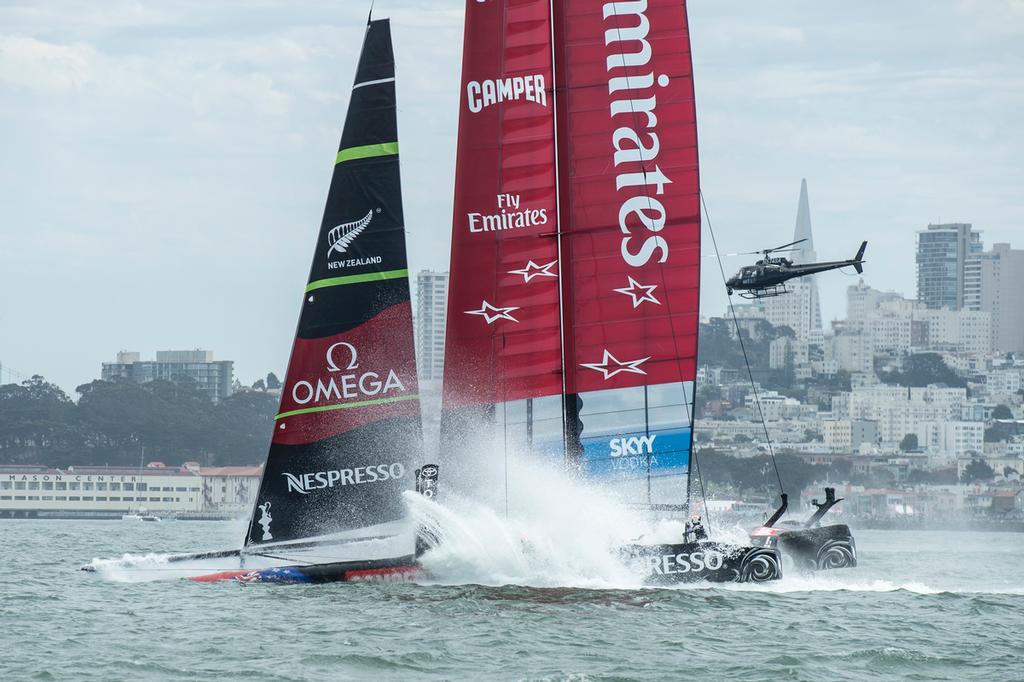 Emirates Team New Zealand bury the bows in the bear away at the top mark in their first race of the Louis Vuitton finals against Luna Rossa Challenge. Rob Waddell and Chris Ward were lost over board.17/8/2013 © Chris Cameron/ETNZ http://www.chriscameron.co.nz